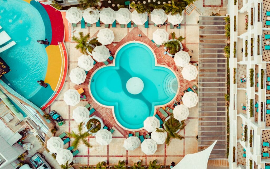 pexels-photo-2646097 Stunning aerial photo of a colorful resort pool in Cancún, Mexico, showcasing vibrant design.